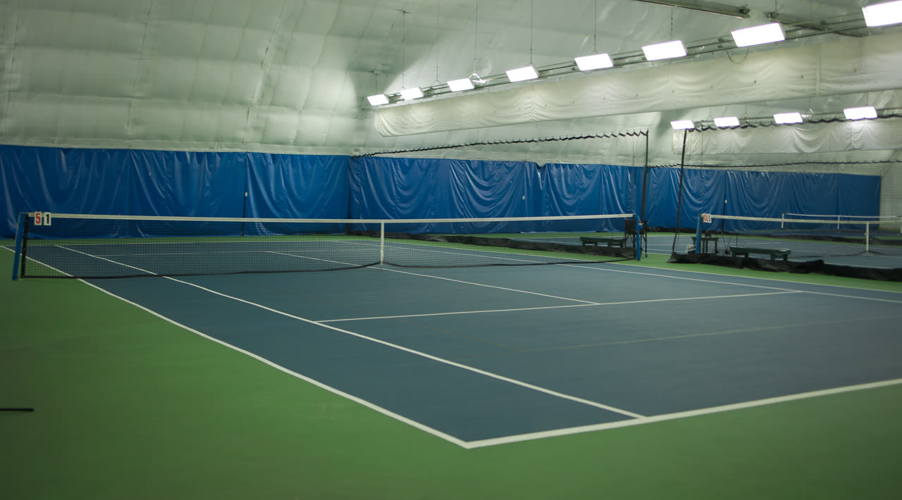 An empty indoor hard court at Match Point KC